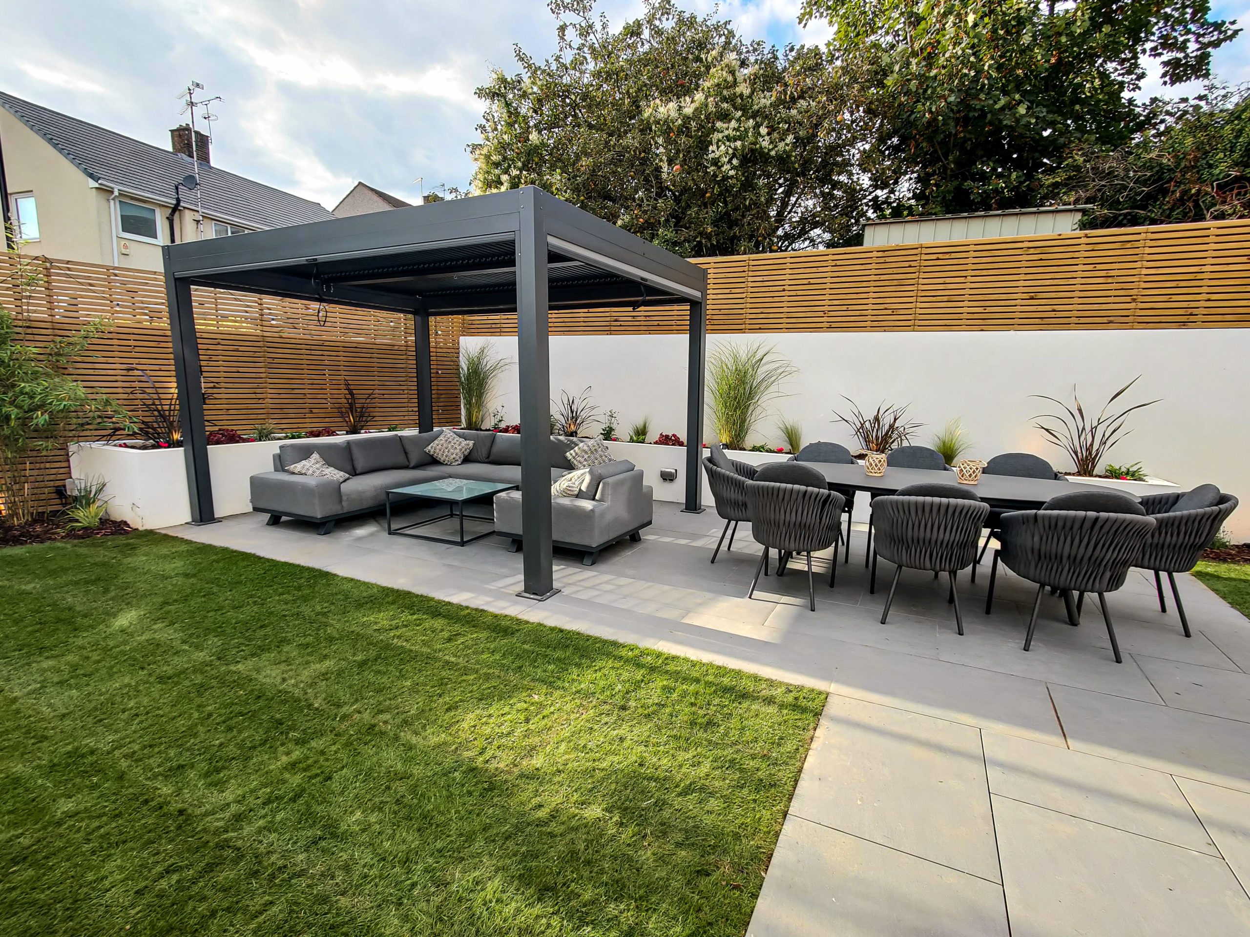Bromley family garden with raised beds, patio, pergola and slatted fencing