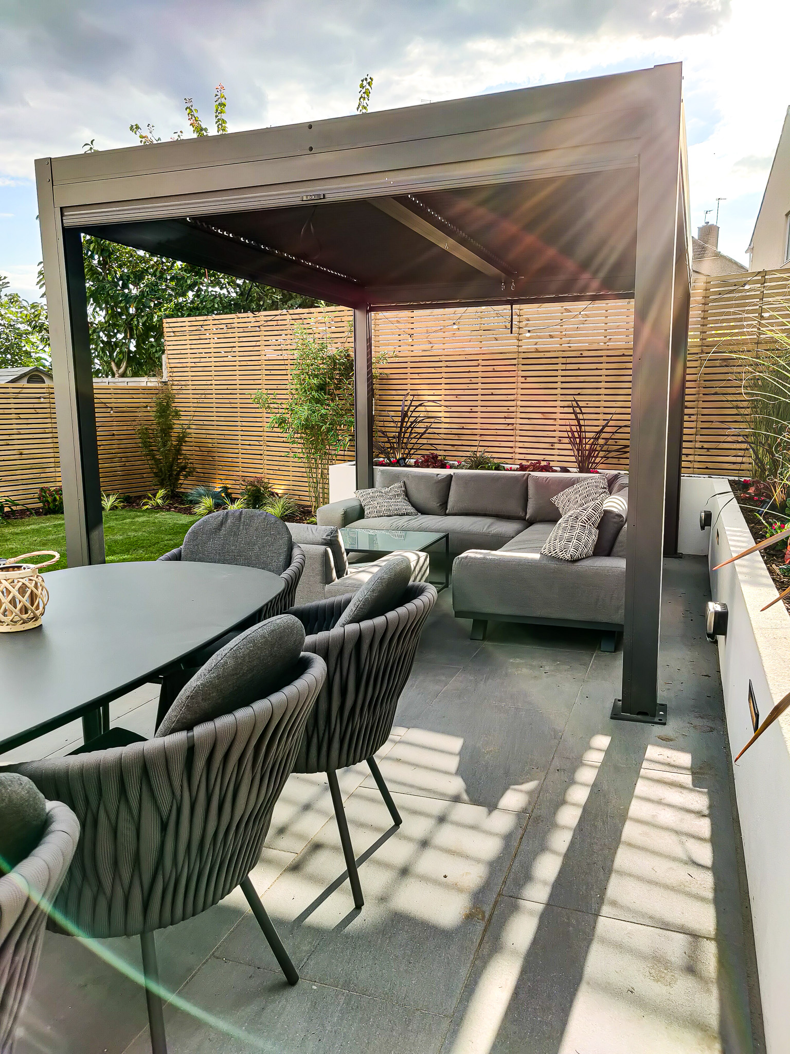 Bromley garden with sofa set and pergola and dining set