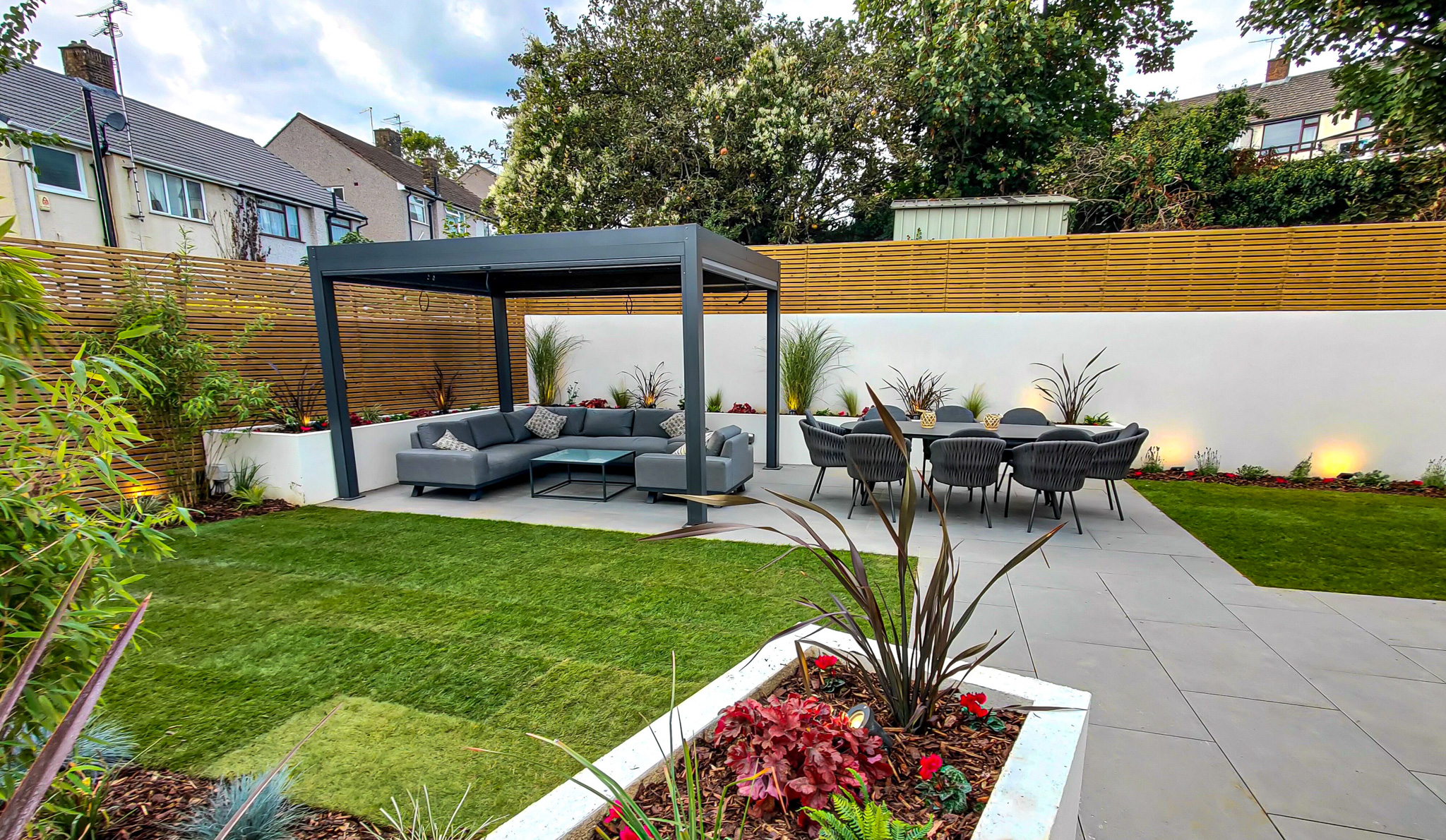 Bromley family garden with raised beds, patio, pergola and slatted fencing